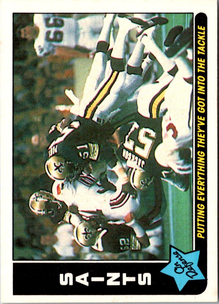 1985 Fleer Team Action Putting Everything They've Got into the Tackle (Defense)