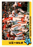 1985 Fleer Team Action Reaching for the Deflection (Defense) #35