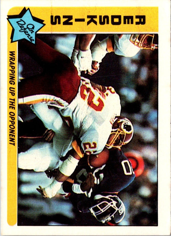 1985 Fleer Team Action Wrapping Up the Opponent (Defense) #83